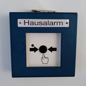 Ein Hausalarm Taster